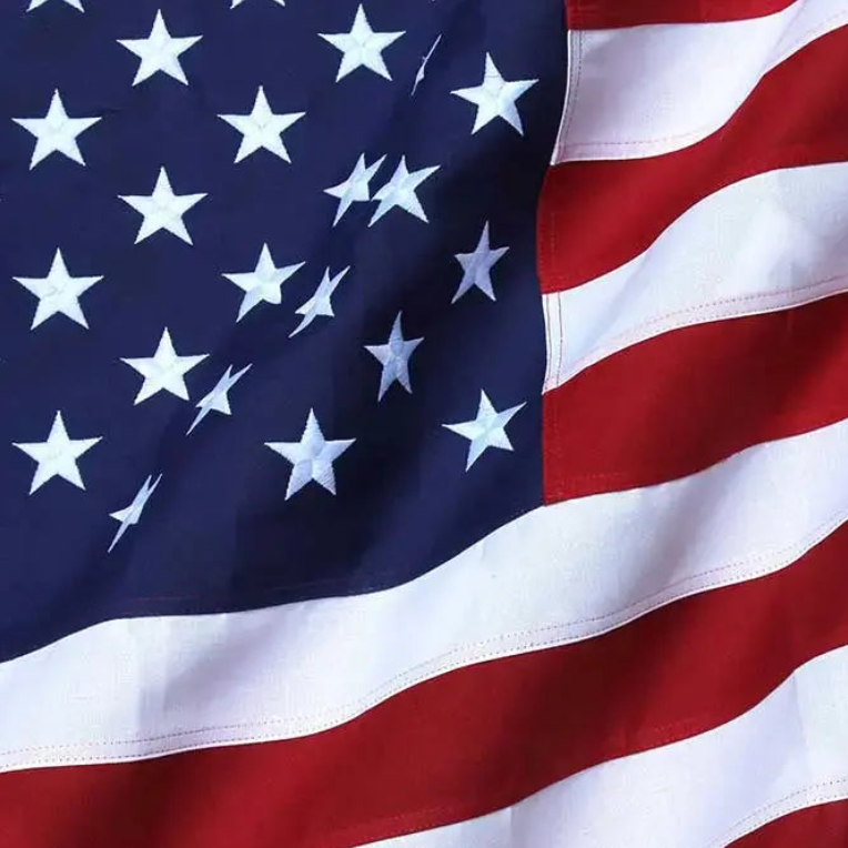 Close-up of durable polyester American flag showing stitching and fabric texture