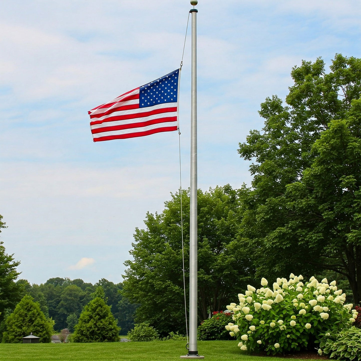 American flagpole with mounting hardware displayed against scenic outdoor background