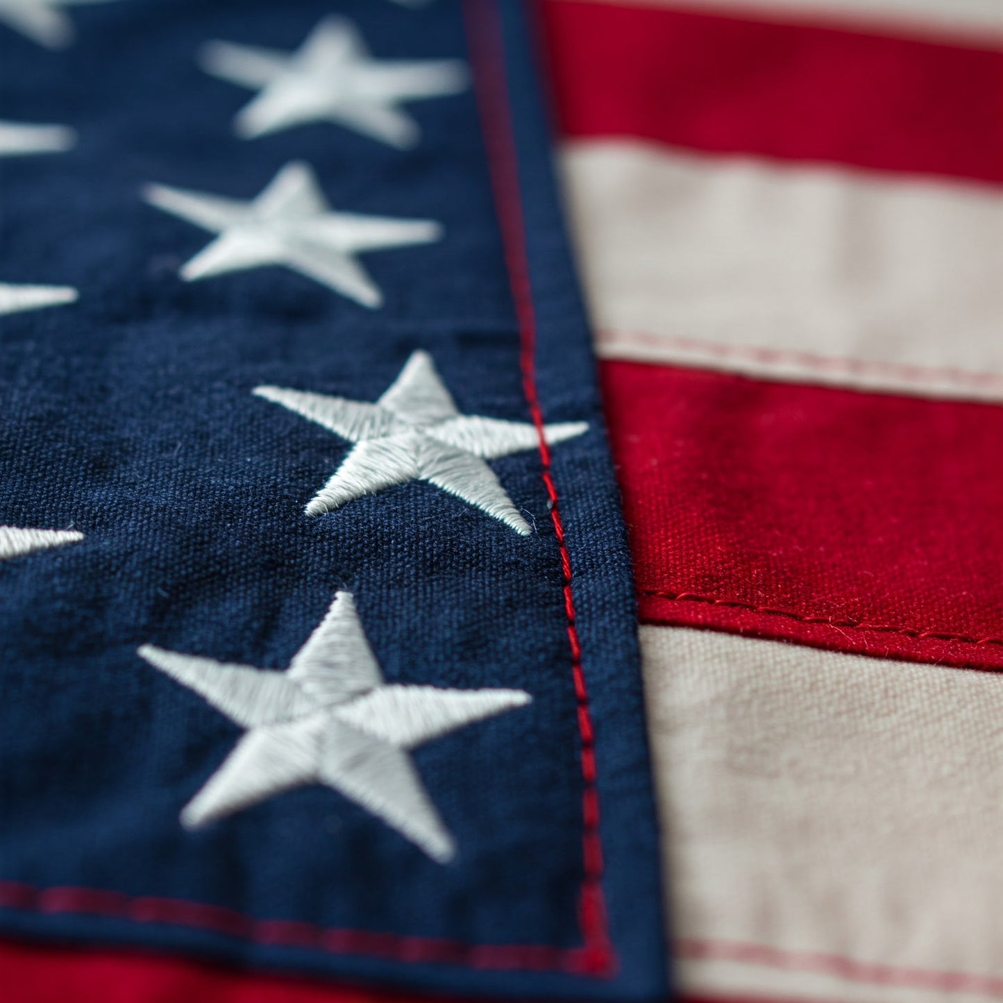 Close-up of sewn two-ply polyester American flag highlighting fabric texture and stitching